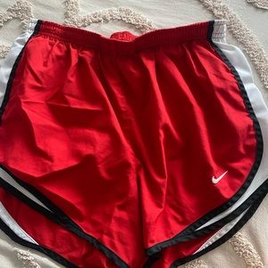 red nike shorts
